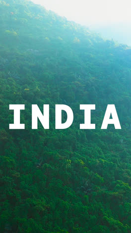 Vertical-Video-Aerial-Drone-Shot-Of-Forests-And-Mountains-In-India-With-Animated-Graphic-Spelling-Out-India